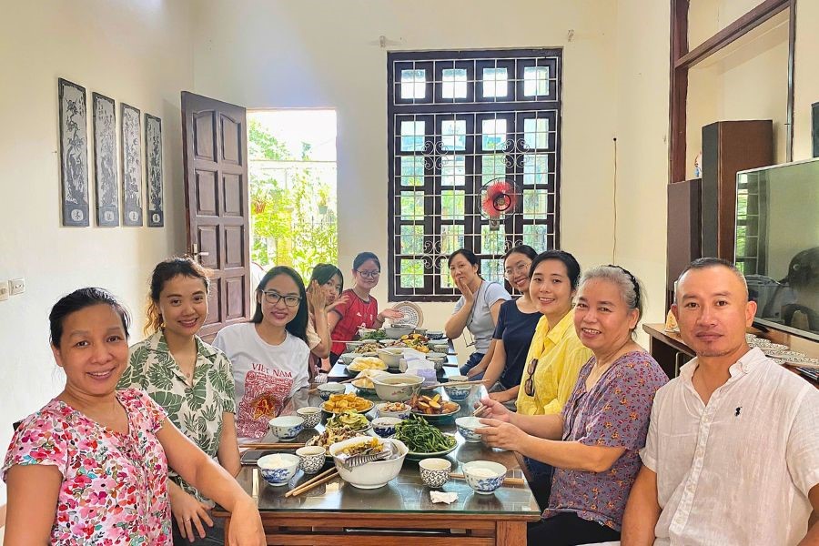 Eviva Tour Team enjoys a warm home meal with a Hanoi local family