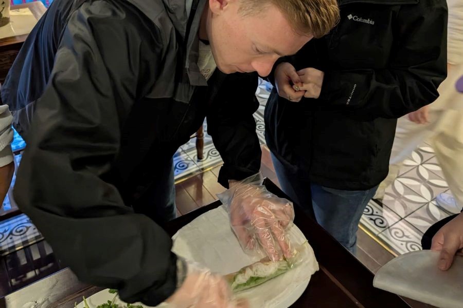 Making fresh Vietnamese spring rolls, rolling each one by hand.